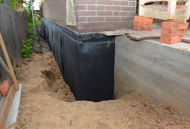 Happy homeowners after waterproofing job in Austell